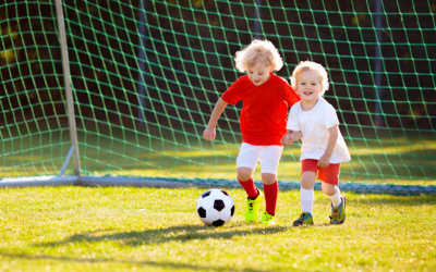 two children playing football
