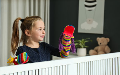 kid playing puppet